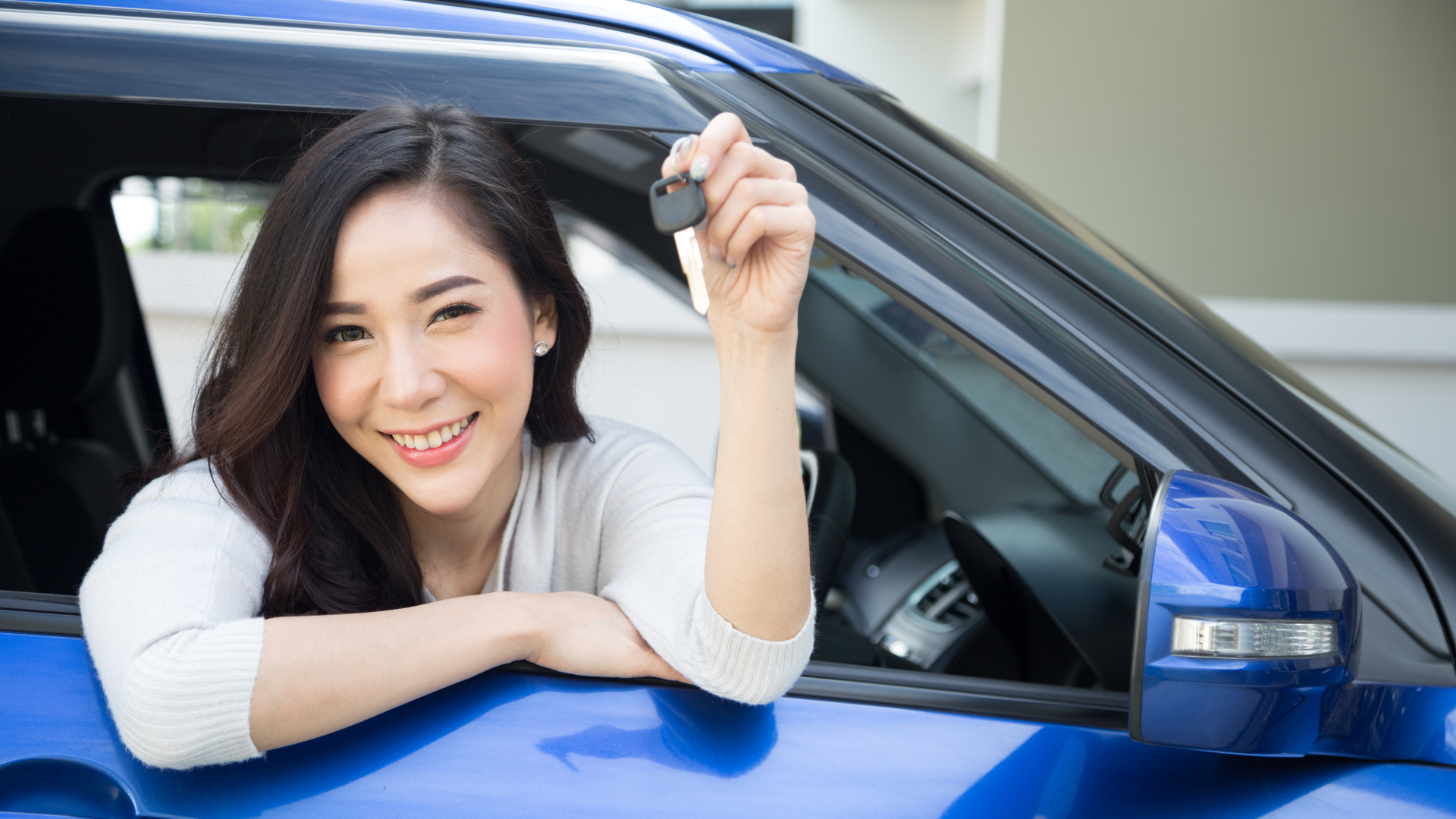 happy woman, driving, car, car keys
